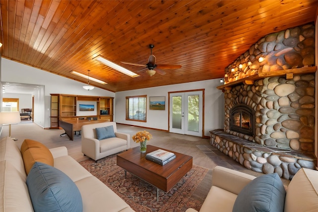 61574 Hillside Rd, Saint Ignatius, MT 59865 - living area featuring baseboards, lofted ceiling with skylight, ceiling fan, and carpet floors