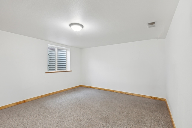 61574 Hillside Rd, Saint Ignatius, MT 59865 - empty room featuring carpet floors, baseboards, and visible vents