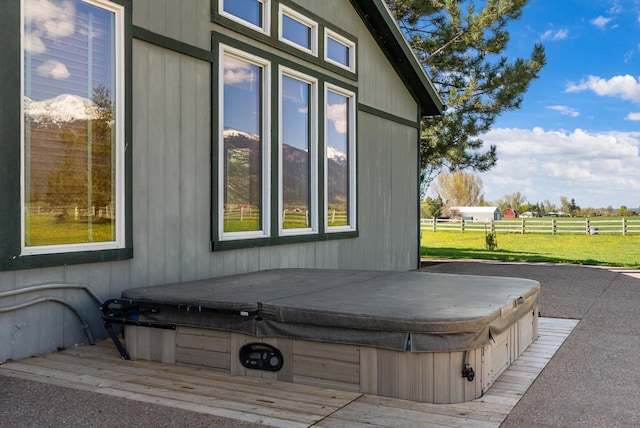 61574 Hillside Rd, Saint Ignatius, MT 59865 - view of property exterior featuring fence and a covered hot tub