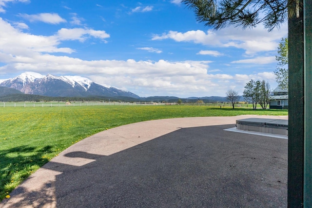 61574 Hillside Rd, Saint Ignatius, MT 59865 - exterior space with a mountain view, a rural view, fence, and a patio