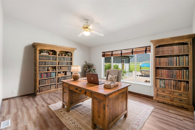 61574 Hillside Rd, Saint Ignatius, MT 59865 - office with light wood finished floors, baseboards, lofted ceiling, and ceiling fan