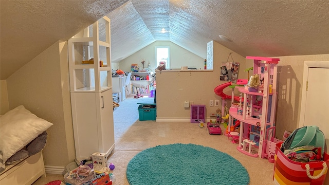 recreation room with baseboards, carpet flooring, a textured ceiling, and vaulted ceiling