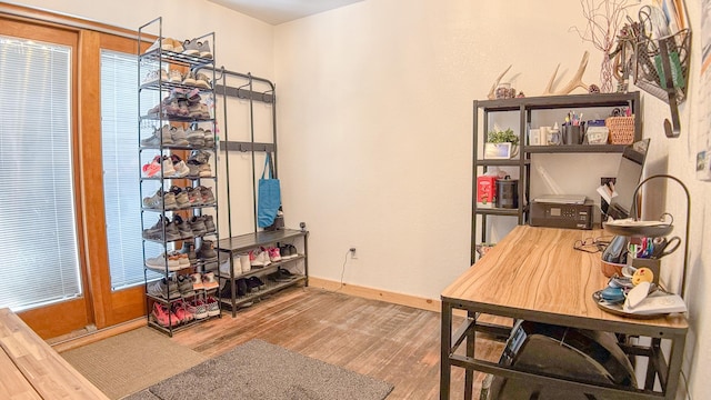 office featuring baseboards and wood finished floors