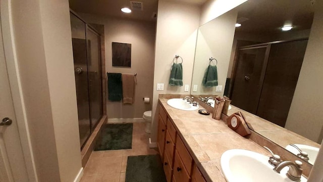 6310 Locarno Dr Unit J, Whitefish, MT 59937 - full bathroom featuring tile patterned flooring, a stall shower, double vanity, and recessed lighting