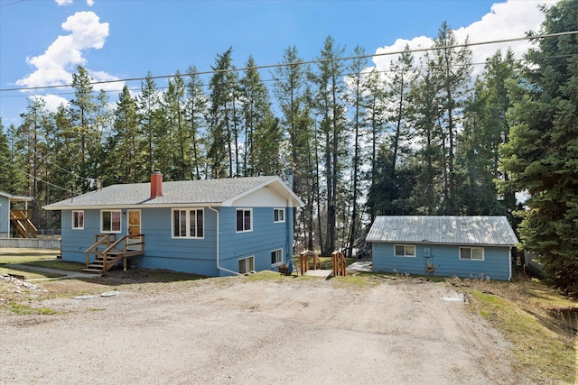 172 Holt Dr Unit A, B & C, Bigfork, MT 59911 - ranch-style home featuring a chimney