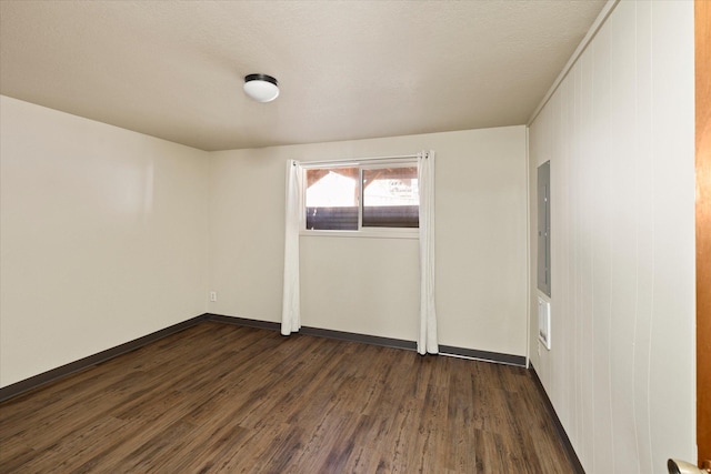 172 Holt Dr Unit A, B & C, Bigfork, MT 59911 - spare room featuring baseboards and dark wood finished floors