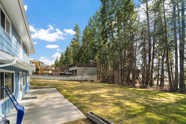 172 Holt Dr Unit A, B & C, Bigfork, MT 59911 - view of yard featuring a patio area and fence