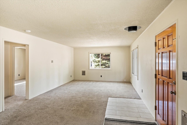 172 Holt Dr Unit A, B & C, Bigfork, MT 59911 - empty room featuring carpet flooring and a textured ceiling