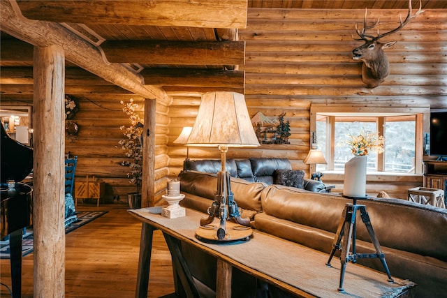 interior space featuring wooden ceiling, log walls, wood finished floors, and beamed ceiling
