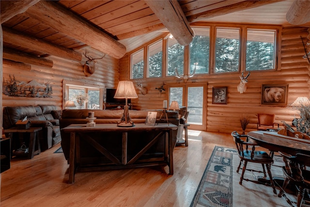 4212 Foothill Rd, Kalispell, MT 59901 - living area with rustic walls, a wood ceiling with exposed beams, high vaulted ceiling, and light wood-style floors