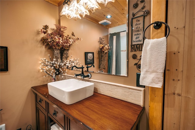 bathroom featuring visible vents, wooden ceiling, a chandelier, vanity, and recessed lighting
