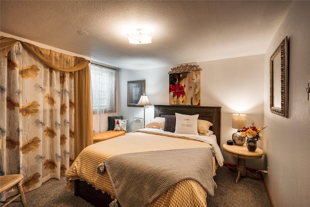 carpeted bedroom featuring a textured ceiling
