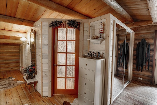 4212 Foothill Rd, Kalispell, MT 59901 - hall featuring log walls, light wood finished floors, and wood ceiling