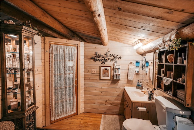bathroom with toilet, wood walls, wood ceiling, and hardwood / wood-style flooring