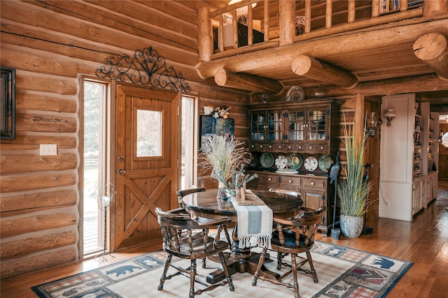 4212 Foothill Rd, Kalispell, MT 59901 - dining space featuring log walls and hardwood / wood-style flooring