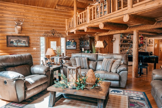 4212 Foothill Rd, Kalispell, MT 59901 - living room with a wood ceiling with exposed beams, log walls, and wood finished floors
