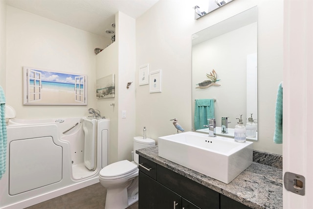 full bath with a tub, toilet, and vanity