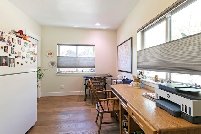 office featuring hardwood / wood-style flooring, baseboards, plenty of natural light, and recessed lighting