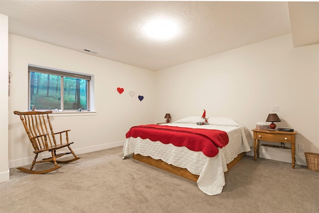 bedroom with carpet flooring, baseboards, and visible vents
