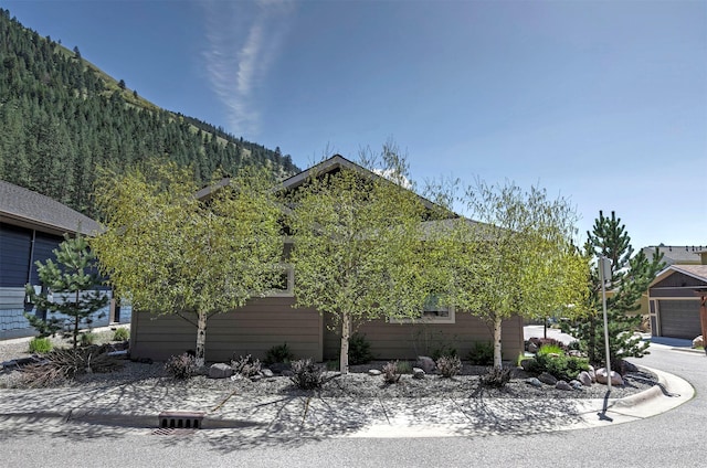 view of home's exterior with a mountain view