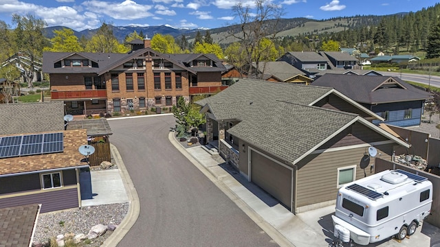 drone / aerial view featuring a mountain view and a residential view