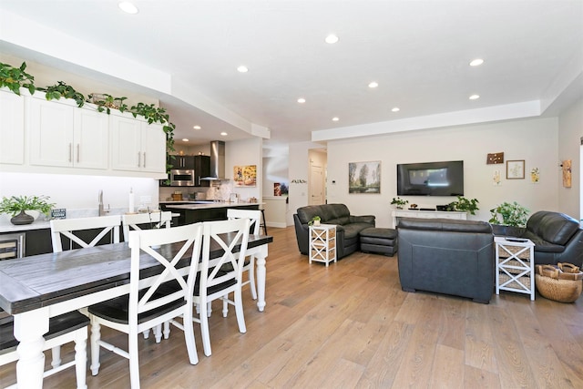 dining room featuring light wood-style flooring and recessed lighting