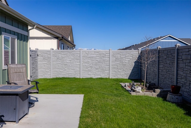 view of yard with a patio and a fenced backyard