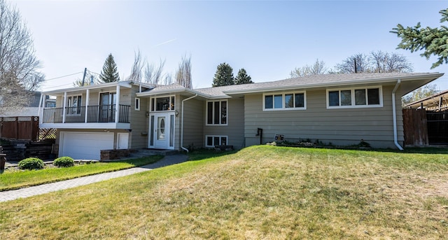4420 7th Ave S, Great Falls, MT 59405 - view of front facade featuring a balcony, a front lawn, and a garage