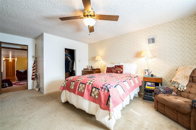 4420 7th Ave S, Great Falls, MT 59405 - carpeted bedroom with a closet, a textured ceiling, visible vents, a walk in closet, and baseboards
