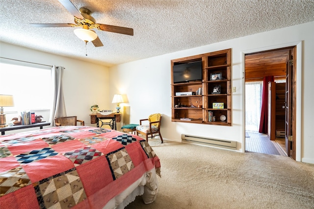 4420 7th Ave S, Great Falls, MT 59405 - bedroom featuring a baseboard heating unit, a textured ceiling, a ceiling fan, and carpet