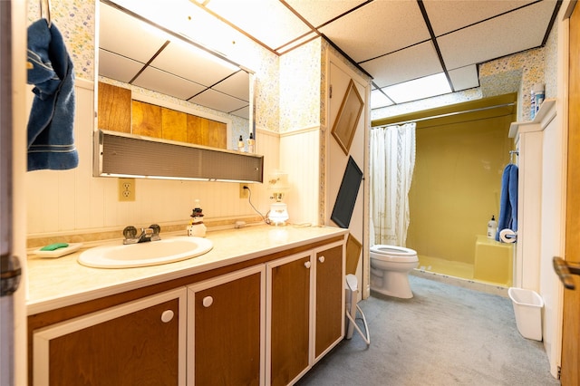 4420 7th Ave S, Great Falls, MT 59405 - full bathroom with a stall shower, wallpapered walls, toilet, vanity, and a paneled ceiling