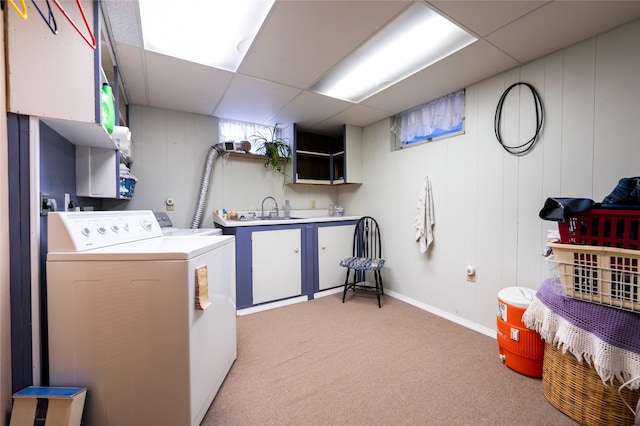 4420 7th Ave S, Great Falls, MT 59405 - laundry area featuring baseboards, a sink, cabinet space, washer and clothes dryer, and light colored carpet