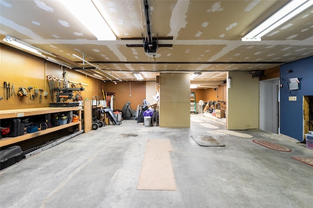 4420 7th Ave S, Great Falls, MT 59405 - garage featuring a workshop area and a garage door opener