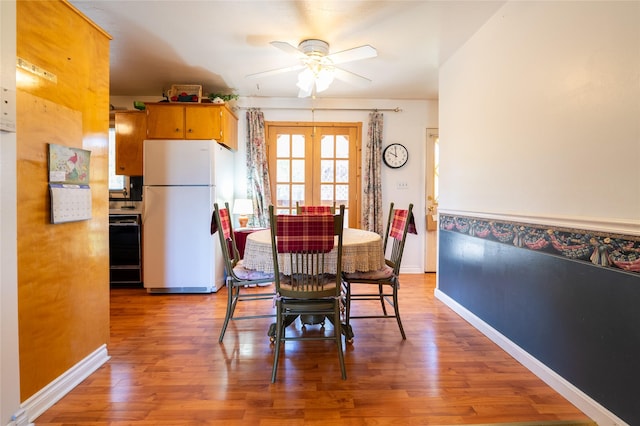 4420 7th Ave S, Great Falls, MT 59405 - dining space featuring french doors, light wood-type flooring, baseboards, and ceiling fan