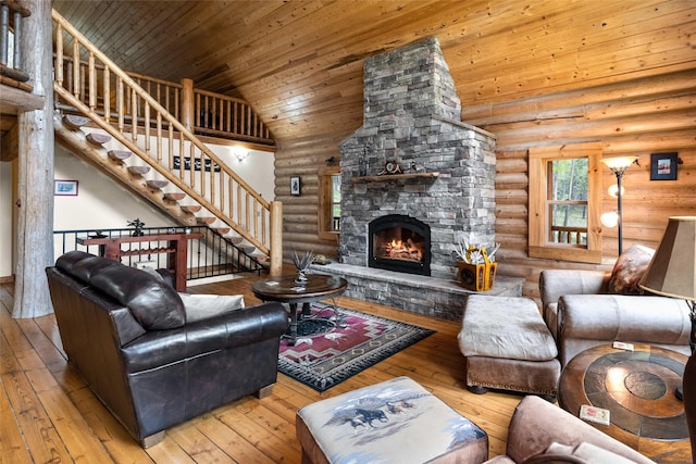 148 Muley Rd, Lakeside, MT 59922 - living room with wooden ceiling, rustic walls, and wood-type flooring