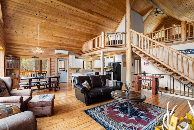 148 Muley Rd, Lakeside, MT 59922 - living area with stairway, light wood finished floors, wood ceiling, and high vaulted ceiling