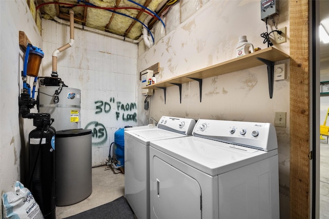 148 Muley Rd, Lakeside, MT 59922 - clothes washing area with secured water heater, laundry area, and washer and dryer