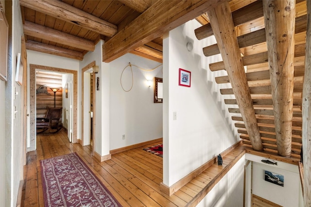 148 Muley Rd, Lakeside, MT 59922 - hallway with wooden ceiling, light wood finished floors, baseboards, and beam ceiling