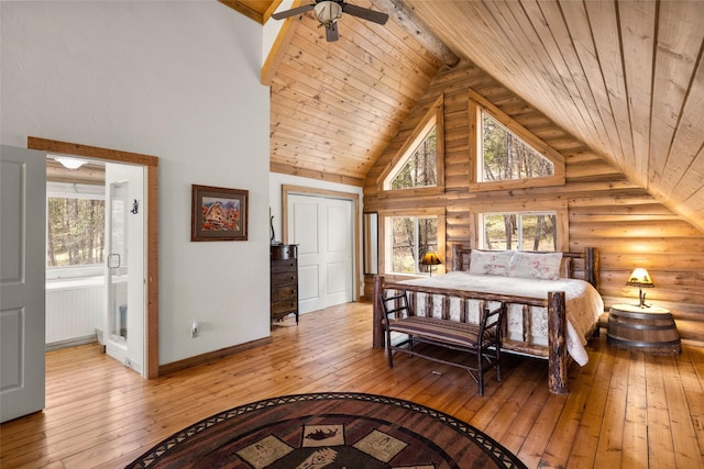 148 Muley Rd, Lakeside, MT 59922 - bedroom featuring multiple windows, light wood-type flooring, and wood ceiling