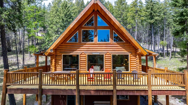 148 Muley Rd, Lakeside, MT 59922 - back of property with log exterior and a wooden deck