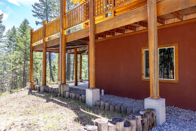 148 Muley Rd, Lakeside, MT 59922 - view of side of home with stucco siding and a deck