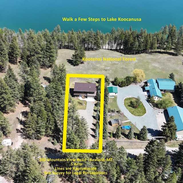 282 Mountain View Rd, Rexford, MT 59930 - aerial view of property and surrounding area featuring property boundaries highlighted and a heavily wooded area
