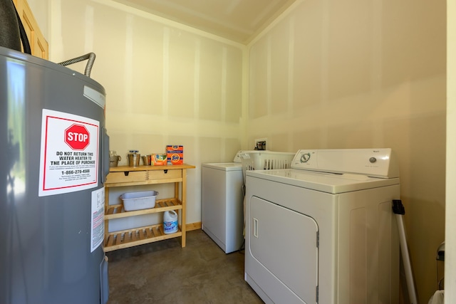 washroom featuring separate washer and dryer, laundry area, and electric water heater
