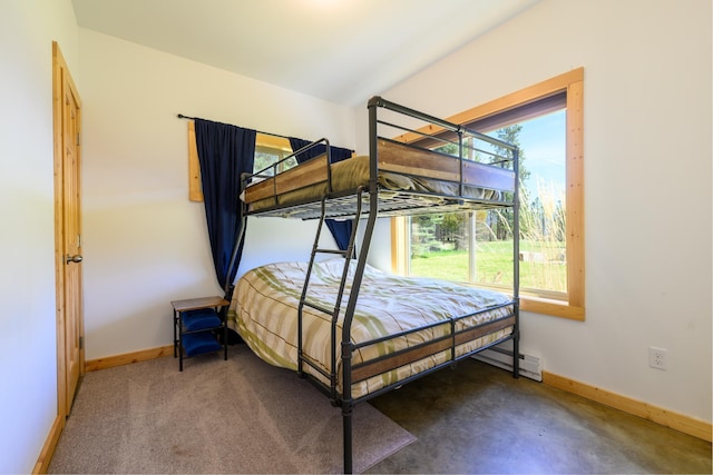 bedroom with baseboards and a baseboard heating unit
