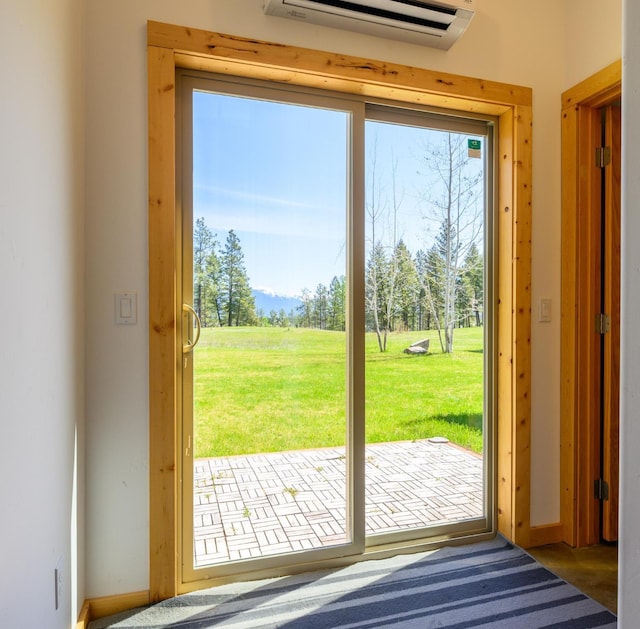 entryway featuring a wall mounted AC and baseboards