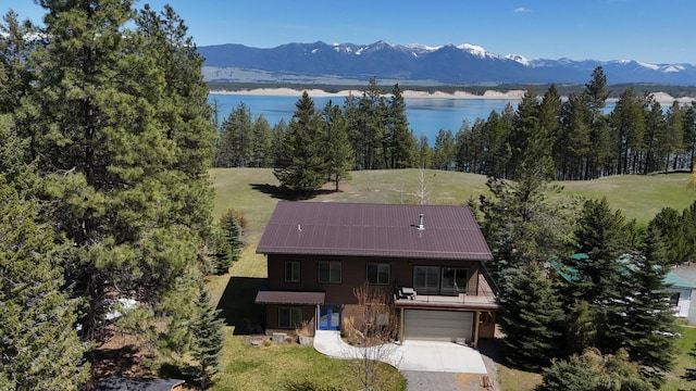 aerial view featuring a water and mountain view