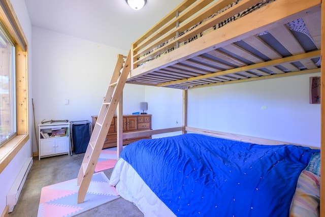 282 Mountain View Rd, Rexford, MT 59930 - bedroom featuring a baseboard heating unit and concrete floors