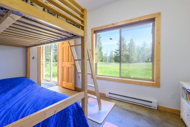 bedroom with a baseboard radiator, finished concrete flooring, and access to outside