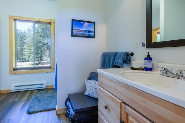 282 Mountain View Rd, Rexford, MT 59930 - bathroom with a baseboard radiator, vanity, and wood finished floors