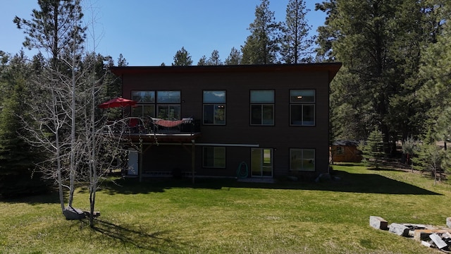 rear view of house with a lawn